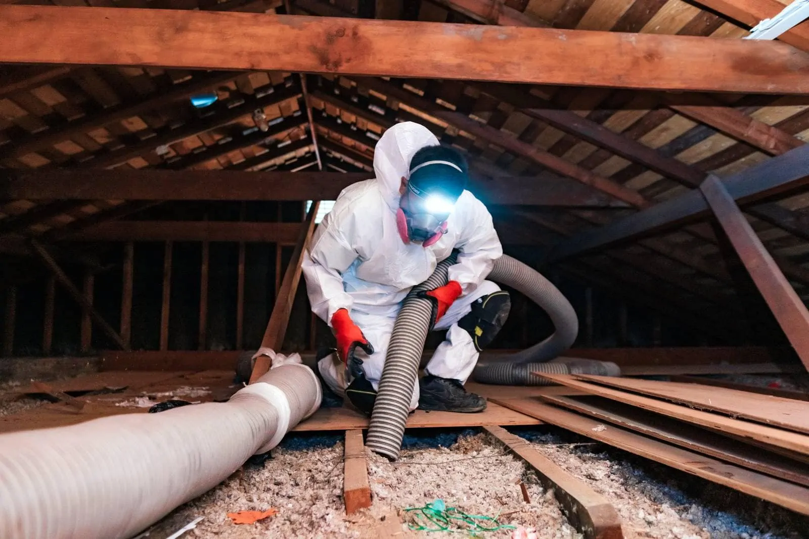 Attic Pros professional removing insulation