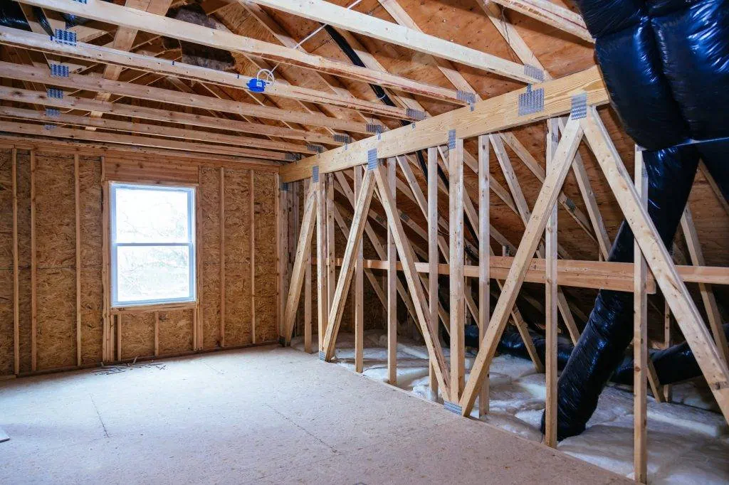 Underside of an attic roof deck where a radiant barrier is installed