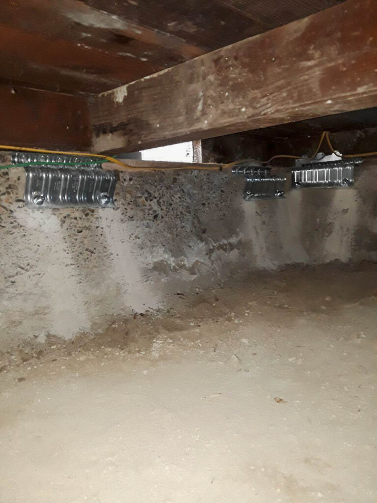 Attic Pros brace-and-bolt seismic retrofit work in a crawl space