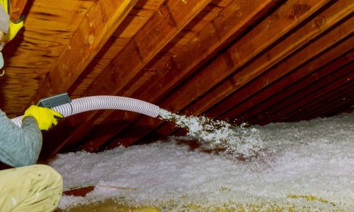 Attic Pros professional spraying insulation in attic
