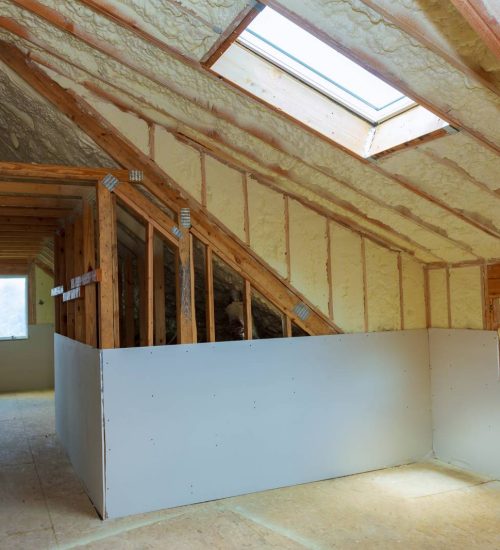 termal-insulation-installing-at-the-attic-insulation insulated attic area